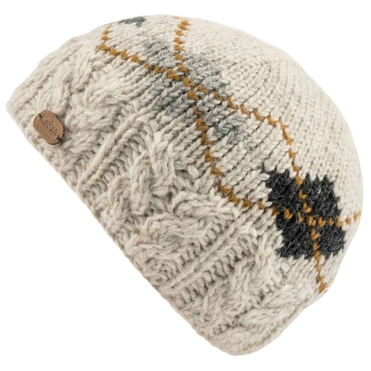 A cream-colored cable-knit beanie hat featuring a subtle argyle pattern in brown, gray, and black, with a small wooden brand tag on the side.