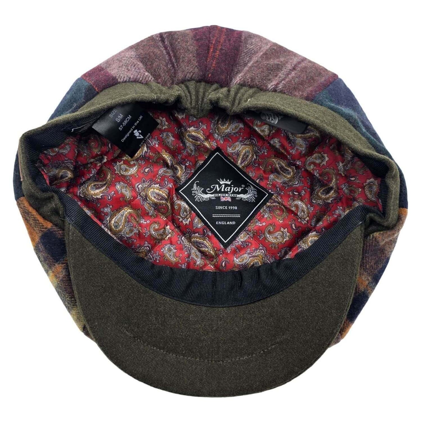 Flannel-patterned cap with a brand label on a white background