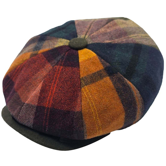 Multicolored checkered flat cap on a white background